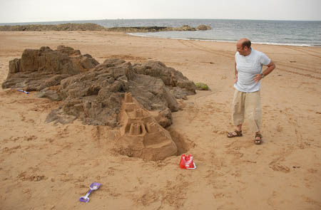 A man proud of his castle, the kids had got bored